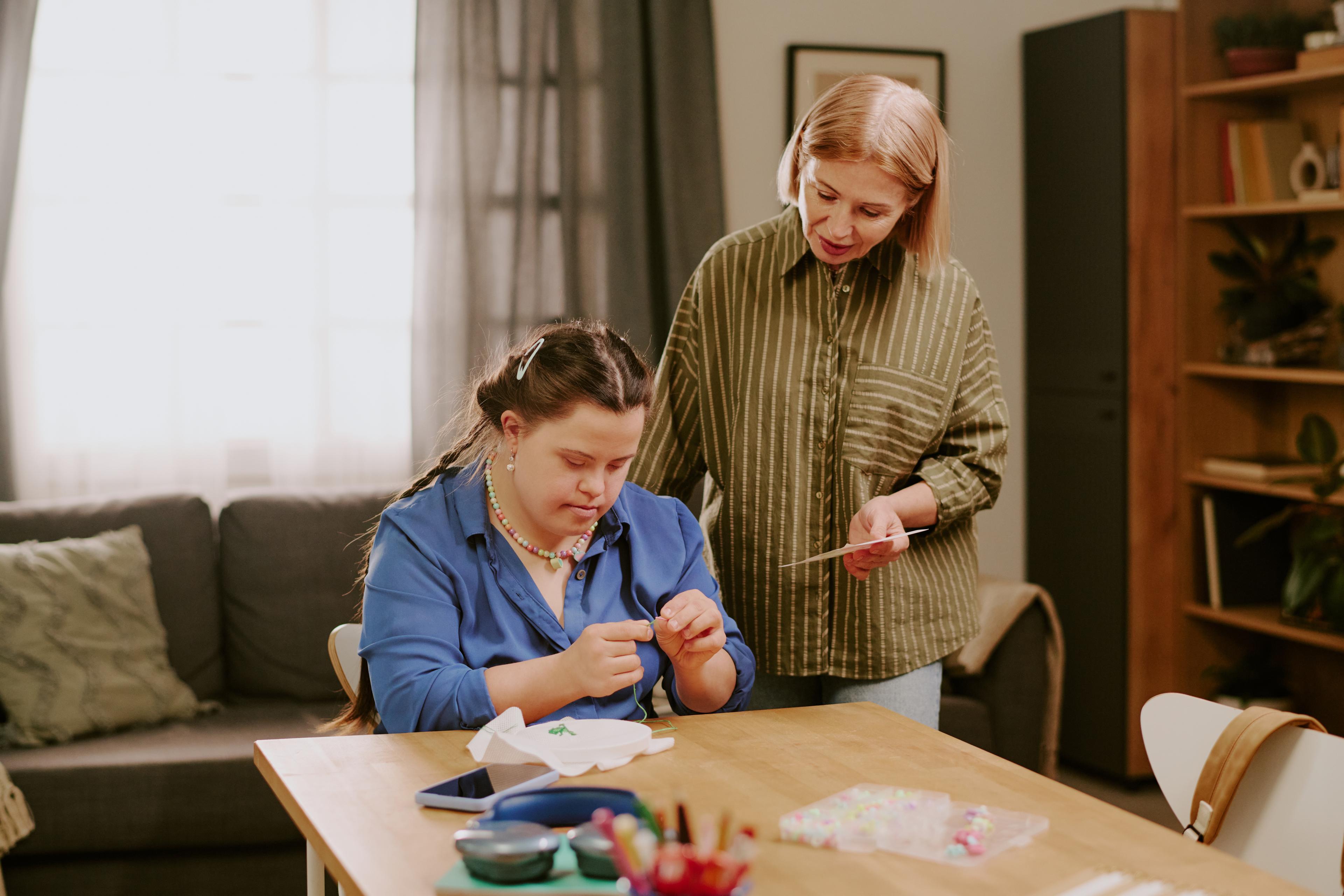 A caregiver sharing a warm, smiling moment with an older resident