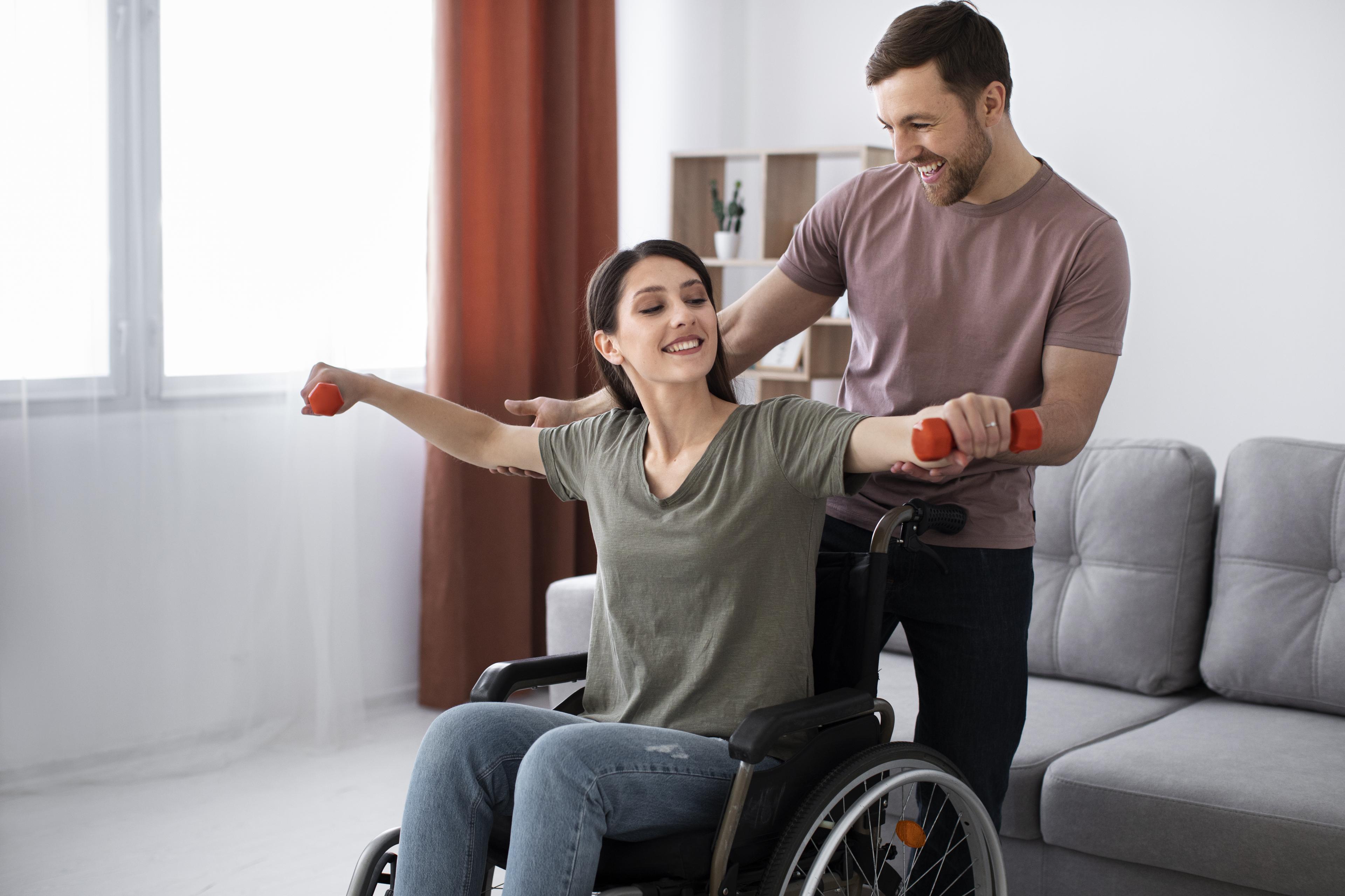 A caregiver gently holding a resident's hand
