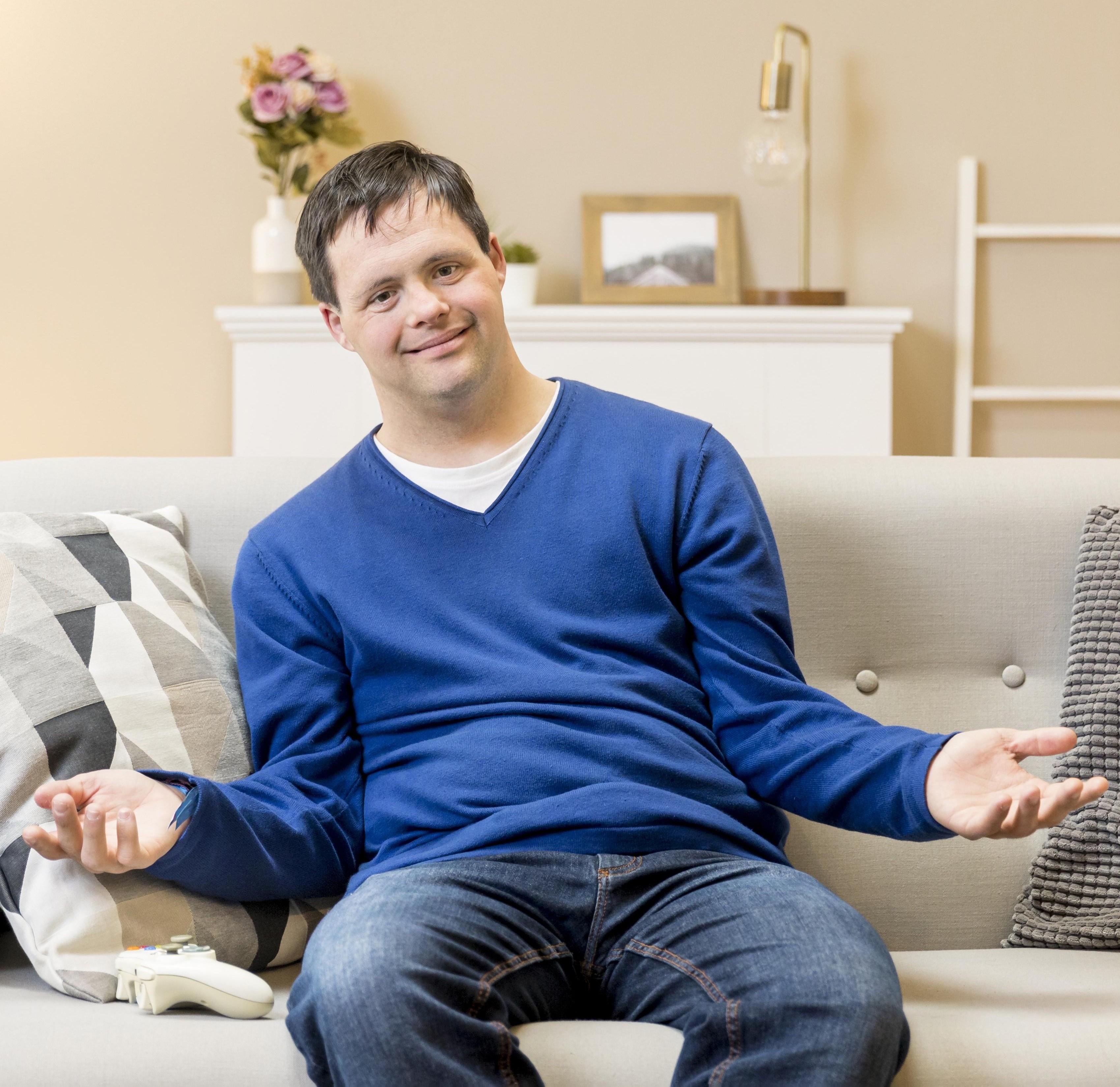 A caregiver and resident laughing together